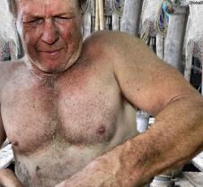 fisherman sea man mending nets shirtless