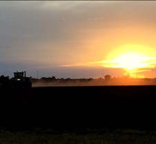 August 23, 2016 Charlie Taylor tractor Farming in America... Finishing up before dark.... Charlie Taylor at controls.