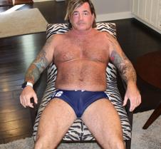very hairy tattooed man