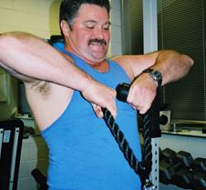 strong man lifting weights gym