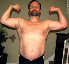 bearded muscle bear biceps