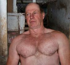 a hot dad working horse barn stalls