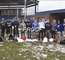 Baseball team clearing snow