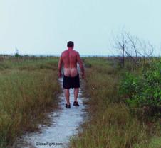 man walking beach nude