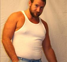 big gay hairy man wearing tanktop