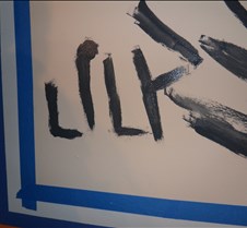 Lily writes her name