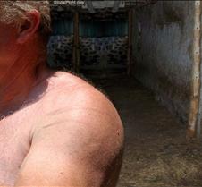 man removing shirt barn farm ranch