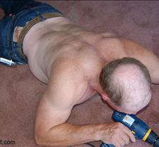 bald man working construction