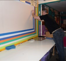 Eric taping the wall