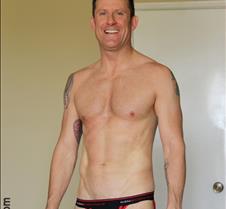 hot musclejock smiling speedos