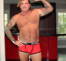 musclebear man flexing arms