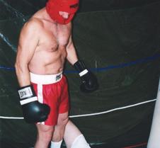 boxer standing over knocked out loser