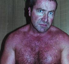 gay bouncer flexing muscles