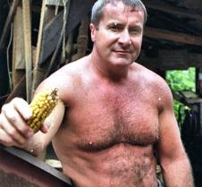 carolina jim rancher holding cob corn