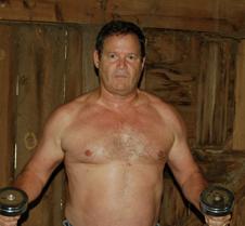 beefy farmer man workingout barn