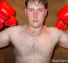 young boxing stud flexing arms