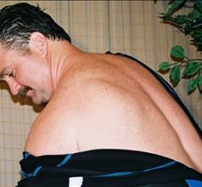 man removing leather spandex swimwear