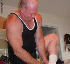 powerlifter putting on shoes