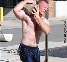 muscleman carrying rocks boulder