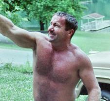 man ripping off siding