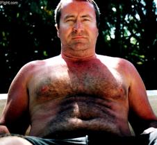 husky man sitting beach hairy navel ches