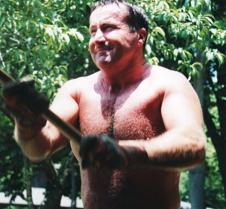 man swinging sledge hammer